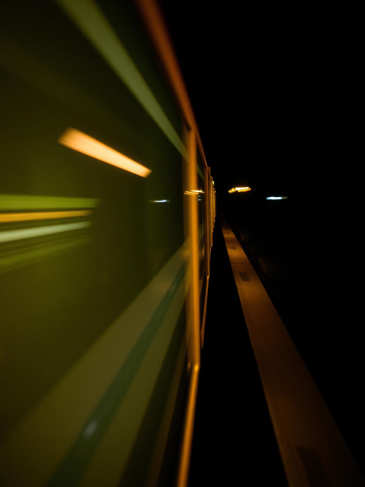 Blurred yellow train at night